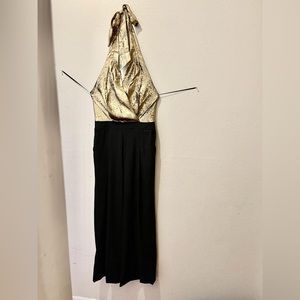 Great condition jumpsuit color black and gold